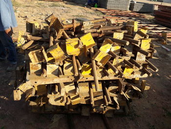 High angle view of yellow stack of wood