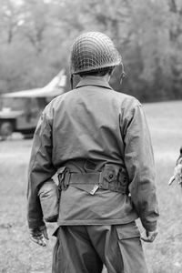 Rear view of army soldier on field
