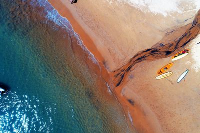 Aerial view of boats moored at beach