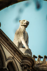 Low angle view of statue against sky