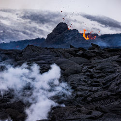 Scenic view of volcanic mountain against sky