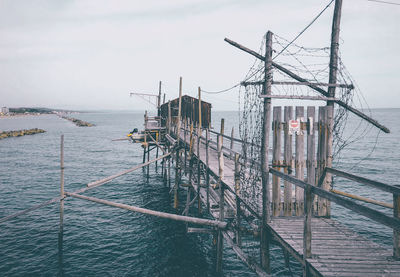 Pier over sea against sky