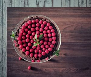 High angle view of strawberries in bowl on table