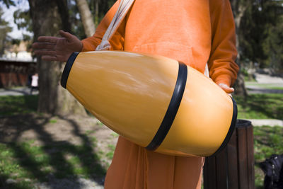 Hare krishna mrdanga drum . close up view . hare krishna man playing traditional indian  mridanga