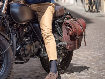 Low angle view of man on motor bicycle