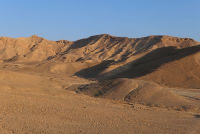 Scenic view of desert against clear sky