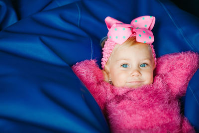 Portrait of cute girl lying on bean bag