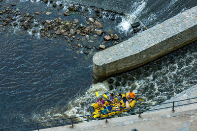 High angle view of people in raft on sea