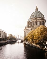 Berlin cathedral by river in city