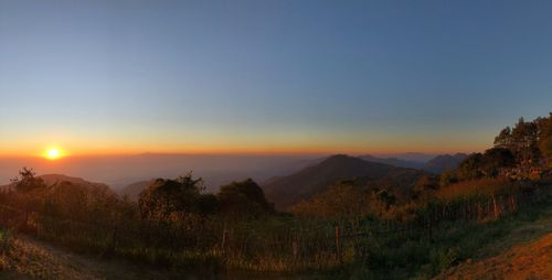 Scenic view of mountains against sky during sunset