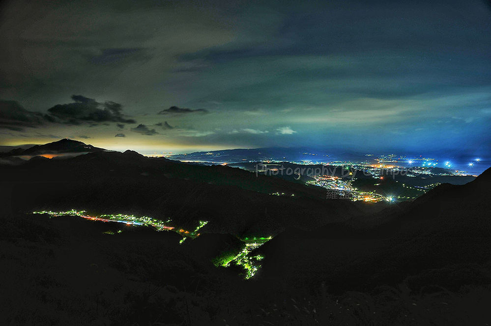 HIGH ANGLE VIEW OF ILLUMINATED CITYSCAPE