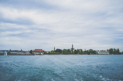 View of city against cloudy sky