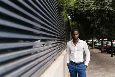 Portrait of young man standing outdoors