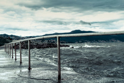 Scenic view of beach against sky during winter