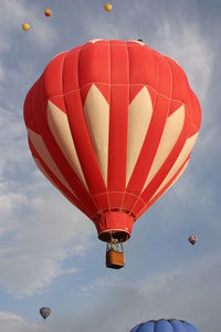 Low angle view of hot air balloon flying against sky