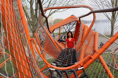 Full length of woman standing in playground