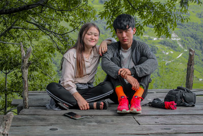 Low angle view of couple sitting 