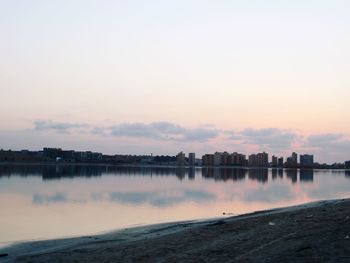 Scenic view of lake against sky during sunset