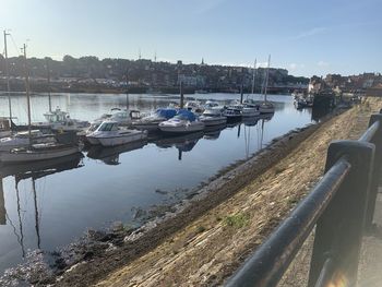 Boats moored at harbor