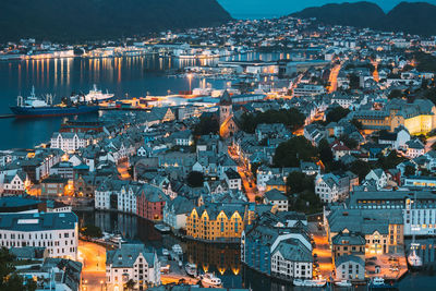 High angle view of illuminated buildings in city at night