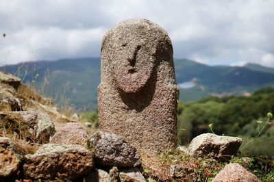 Close-up of cemetery against mountain