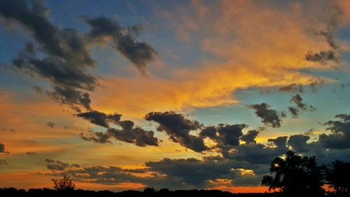 Low angle view of dramatic sky during sunset