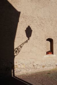 Shadow of cross on wall