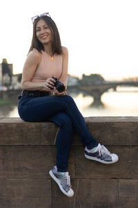 Portrait of photographer woman unfocused background at florence, italy. 50mm lens