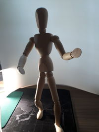 Low angle view of figurine on table