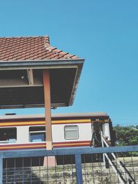 Low angle view of building against clear blue sky