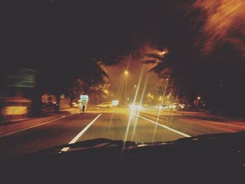 Cars on road at night