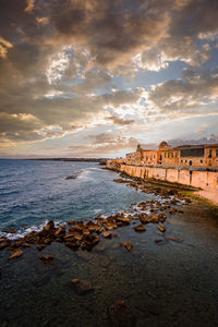 Spectacular sunset over the sea with maniace castle