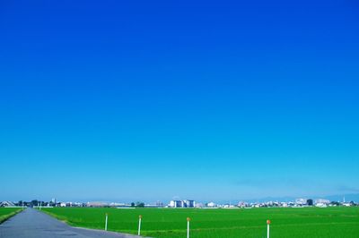 View of landscape against clear blue sky
