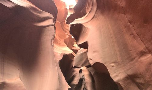 High angle view of people standing on rock formation