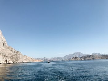 Scenic view of sea against clear blue sky