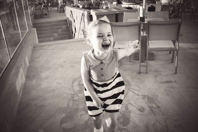 Portrait of laughing girl in restaurant