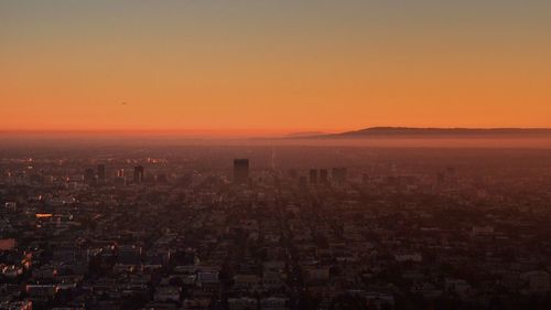 Aerial view of cityscape during sunset