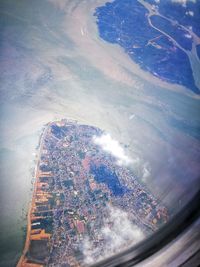 Aerial view of cityscape against sky