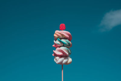 Close-up of ice cream against sky