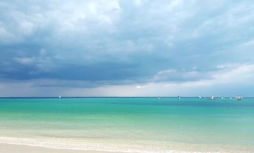 Scenic view of sea against cloudy sky