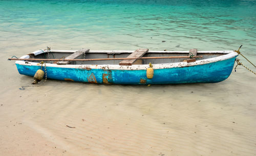 Boats moored on shore