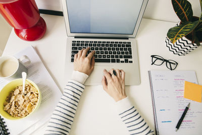 Woman at desk using laptop