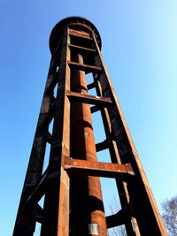 Low angle view of built structure against clear blue sky