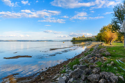 View of lake against cloudy sky
