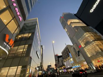 Low angle view of illuminated buildings against sky