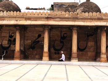 Full length of man outside temple against building