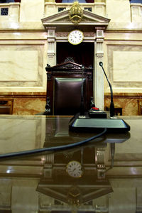 Close-up of clock on table