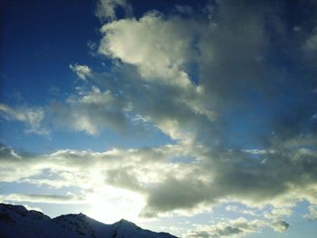 Low angle view of blue sky and clouds