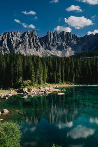 Scenic view of lake and mountains against sky