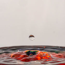 Close-up of drop splashing on water